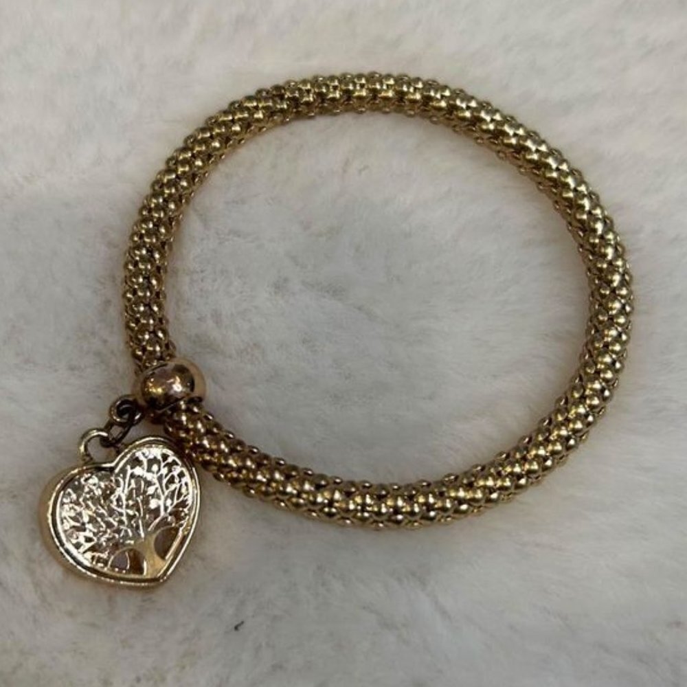 Woman’s charm bracelet. Stretchy. Gold in colour. Excellent condition.